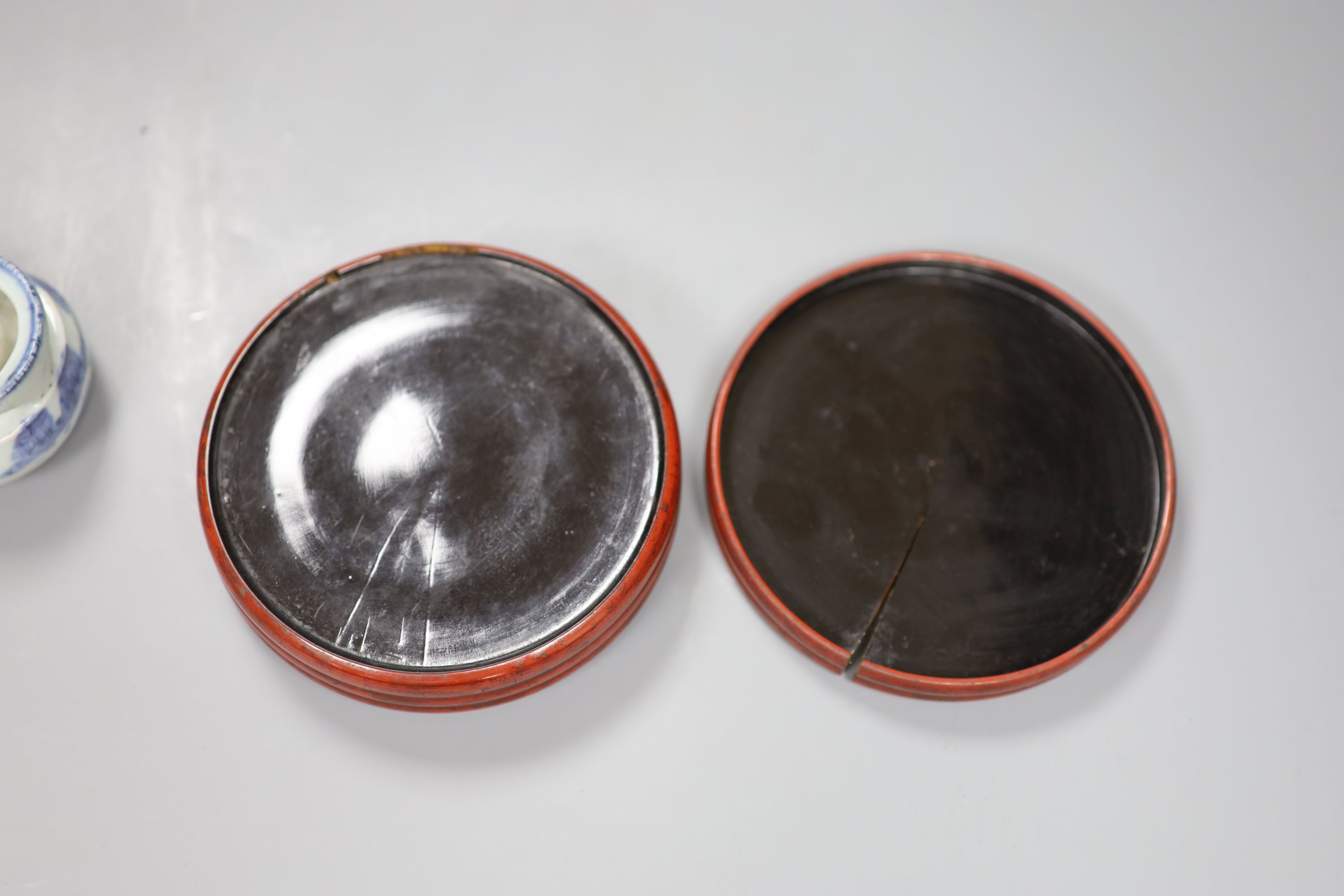 A Chinese red lacquer lidded box, diameter 12.5cm, and a blue and white water dropper